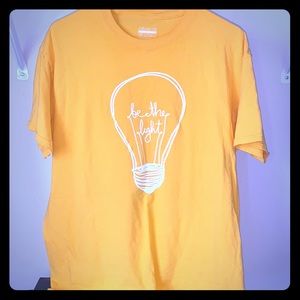 “Be the light” yellow shirt